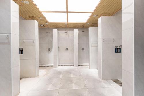 a large room with white walls and a skylight at Holiday Inn Taiyuan Sunshine by IHG in Taiyuan