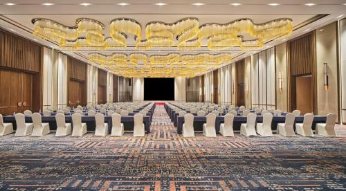 an empty room with chairs and a stage in a building at Crowne Plaza Chengdu Wuhou by IHG in Chengdu