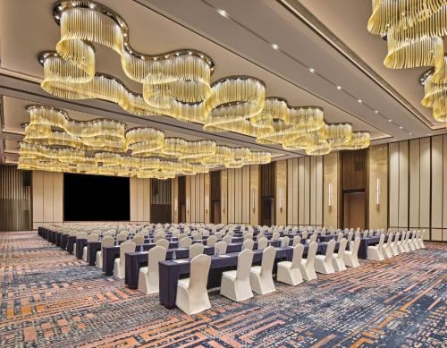 an empty conference room with chairs and chandeliers at Crowne Plaza Chengdu Wuhou by IHG in Chengdu