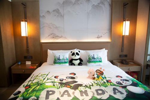 a bedroom with a bed with pandas on it at Crowne Plaza Chengdu Wuhou by IHG in Chengdu