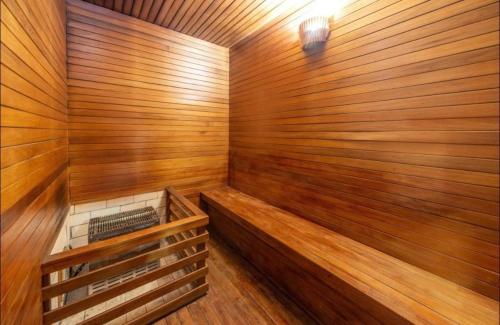 a wooden sauna with a wood paneled wall at Laghetto Stilo Borges - Apto 403B in Gramado