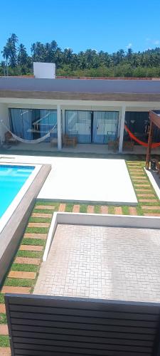 Πισίνα στο ή κοντά στο Casa beach Japaratinga