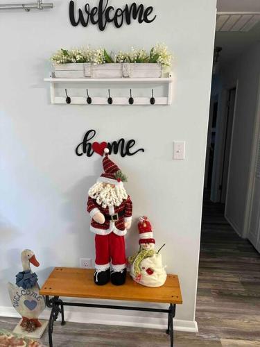 a couple of stuffed animals sitting on a bench at Chesapeake Holiday House in Port Republic