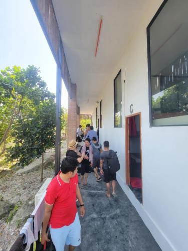 a group of people walking into a building at Top View Kohrong in Koh Rong