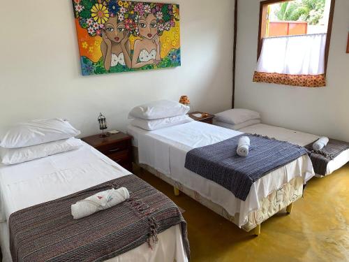 Ένα ή περισσότερα κρεβάτια σε δωμάτιο στο Quinta dos Samaniego - Chalés Rústicos e Suítes