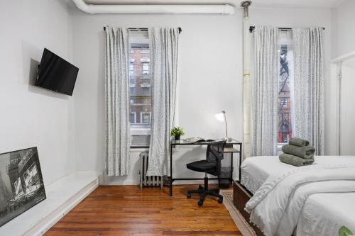 Krevet ili kreveti u jedinici u okviru objekta Sleek 2BR - Walking distance to Times Square