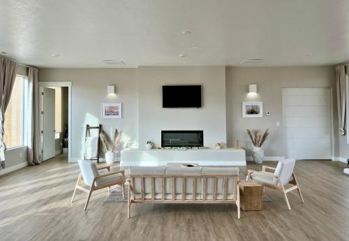 a living room with a couch and a tv at Page Arizona border town- Tranquil Zen Retreat with Amazing Mesa Views in Big Water