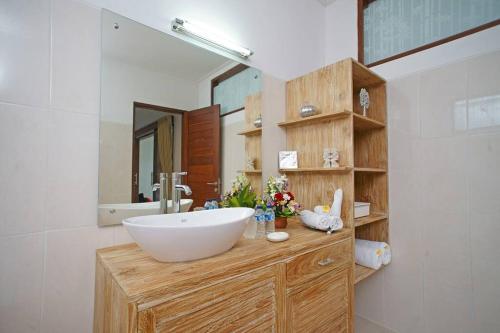 a bathroom with a large sink and a mirror at 5 Bedroom Villa in Centre Location of Seminyak in Seminyak