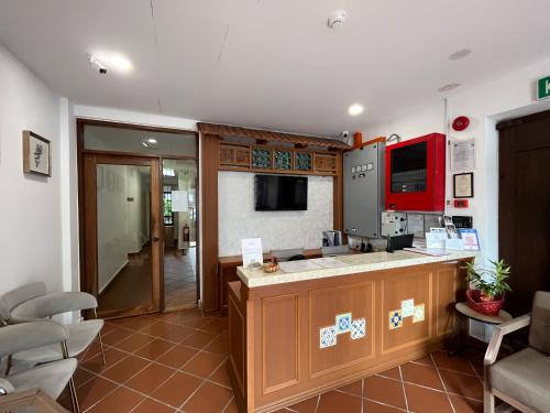 a kitchen with a sink and a counter top at Mclane Boutique Hotel in George Town