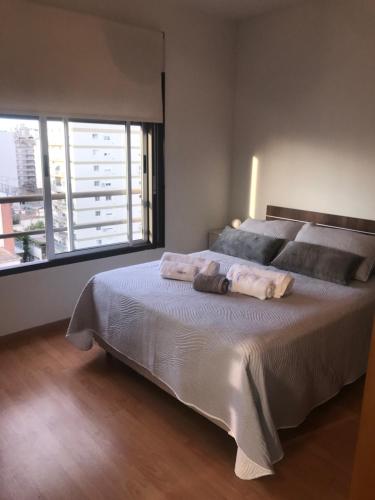 Llit o llits en una habitació de Excelente departamento con ubicación ideal