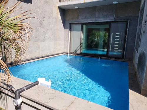 a swimming pool in the backyard of a house at Pool Story 6 in Jeju