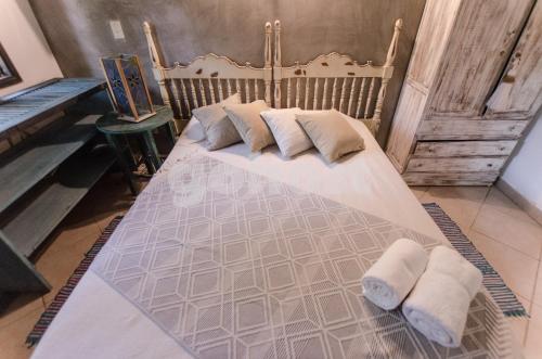 a bedroom with a bed with two pillows on it at Comfortable And Spacious House In San Bernardino in San Bernardino