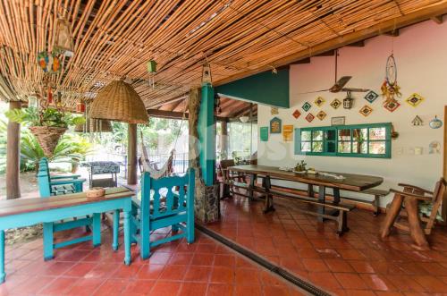 a dining room with wooden tables and chairs at Comfortable And Spacious House In San Bernardino in San Bernardino