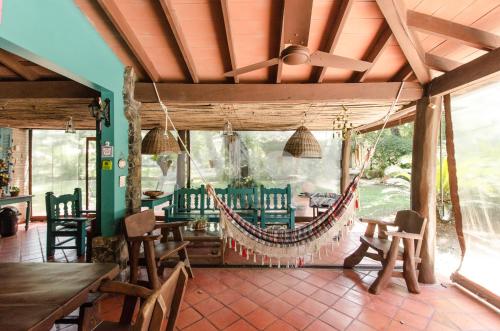 a dining room with a hammock in a house at Comfortable And Spacious House In San Bernardino in San Bernardino
