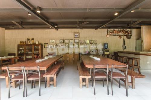 a dining room with a large wooden table and chairs at Comfortable And Spacious House In San Bernardino in San Bernardino