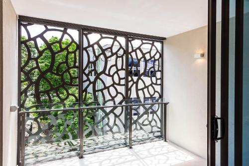 a room with a glass door with a window at Fleet Lane Apartments in Brisbane