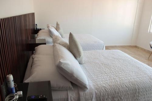 Postel nebo postele na pokoji v ubytování Hotel Zócalo Chilpancingo