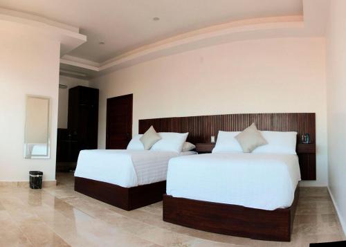 Postel nebo postele na pokoji v ubytování Hotel Zócalo Chilpancingo