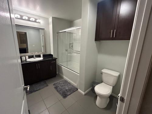 a bathroom with a toilet and a shower and a sink at 2 Bedroom Apartment Downtown LA! in Los Angeles