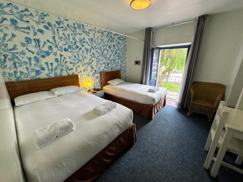 Cama ou camas em um quarto em Posada Villa Mayor