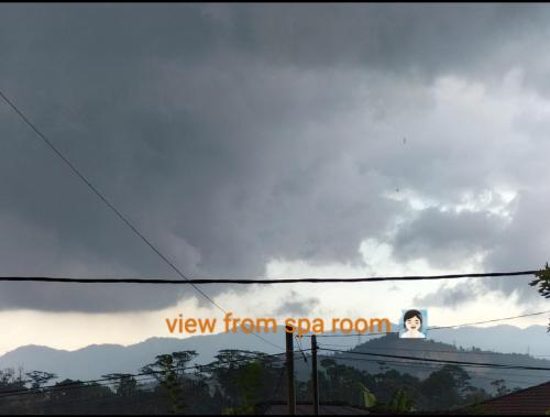 a view from sar room sign on a cloudy sky at D'Ashikin Village Stay in Seremban