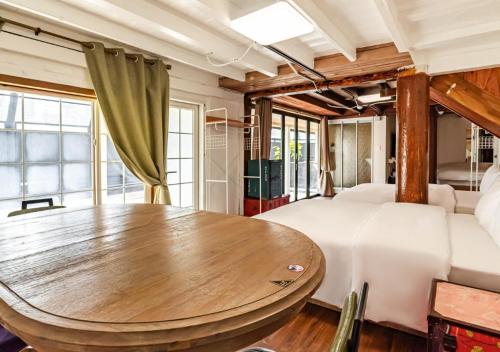 Katil atau katil-katil dalam bilik di Woomigwan Hotel