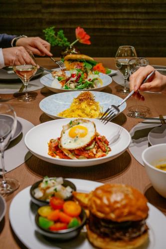 a table with plates of breakfast food on it at MUWA NISEKO in Kutchan