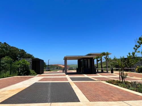 a bus stop with a blue sky in the background at Zimbali Lakes Boulevard Suites in Ballito