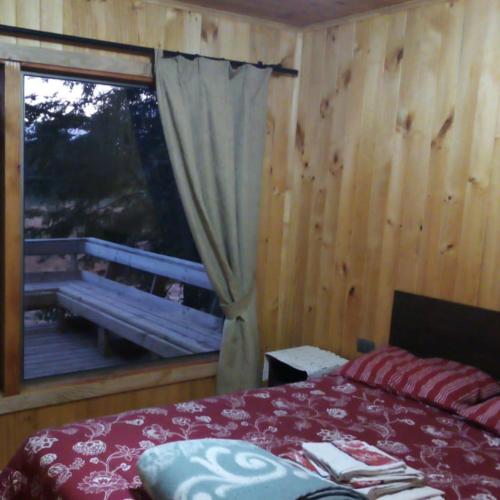 Postel nebo postele na pokoji v ubytování Mi Pequeño Paraiso Caburgua