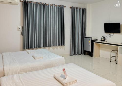 Postel nebo postele na pokoji v ubytování Jacky Chan Hotel