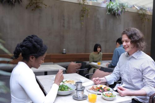 two women sitting at a table eating food at NOHGA HOTEL KIYOMIZU KYOTO in Kyoto