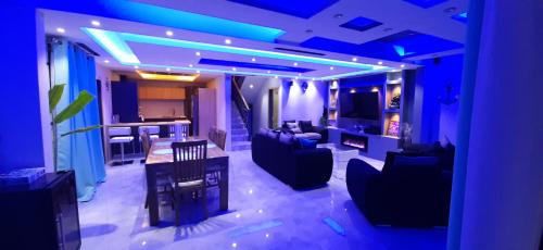 a living room with blue lights on the ceiling at Meliyer cheerful 3 bedrooms villa at perebere in Pereybere