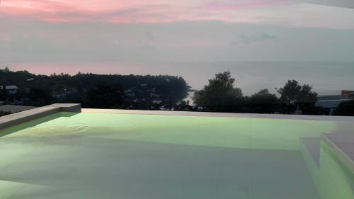 a swimming pool with a view of the sky at Infinity Villa in Salad Beach