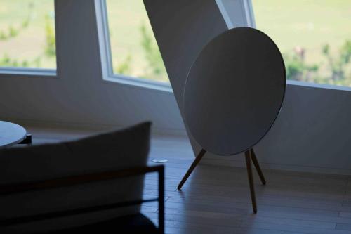 a chair sitting in a living room next to a couch at wanderlust,SHIMA in Shima
