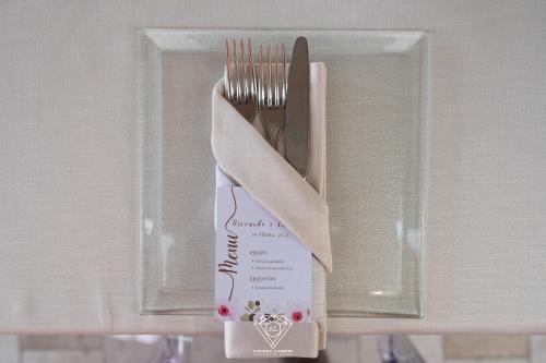 a knife and fork in a holder with a napkin at La Rondanina in Castelnuovo Fogliani