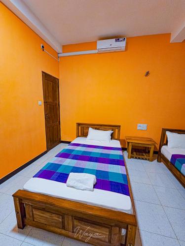 Ένα ή περισσότερα κρεβάτια σε δωμάτιο στο Yoma Wild Hotel