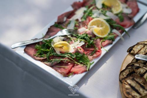 two plates of food on a table with a pizza at La Rondanina in Castelnuovo Fogliani