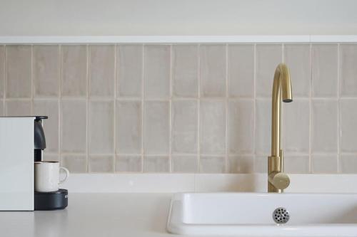 a kitchen counter with a sink with a faucet at Studio 10 / Tenerife in Chayofa