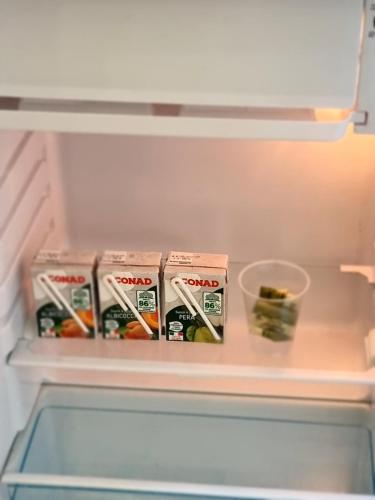 a refrigerator with some food inside of it at B&B Pescara Centro Luxury Suite in Pescara
