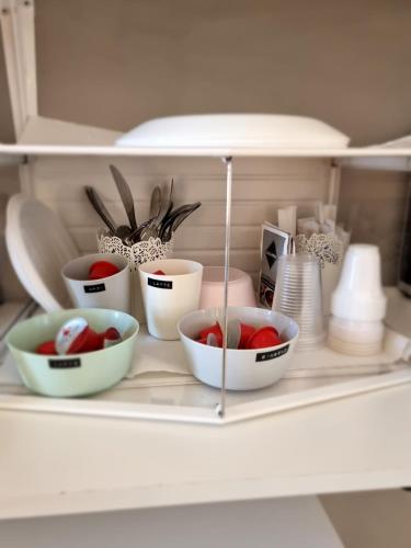 a shelf with bowls of food in a refrigerator at B&B Pescara Centro Luxury Suite in Pescara