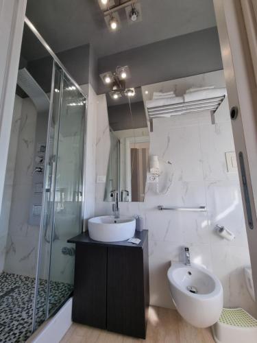 a bathroom with a sink and a toilet and a shower at B&B Pescara Centro Luxury Suite in Pescara