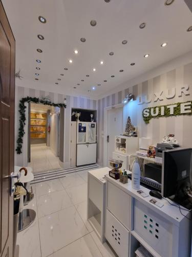 a kitchen with white appliances in a store at B&B Pescara Centro Luxury Suite in Pescara