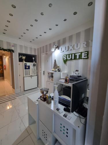 a living room with a computer on a desk at B&B Pescara Centro Luxury Suite in Pescara