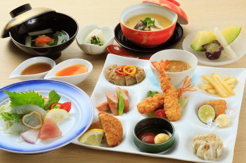a table topped with plates of food and bowls of soup at Yutorelo Tsuwano in Tsuwano