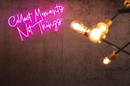 a neon sign that says almostimate not things at PHILSON Apartments in Saalbach Hinterglemm