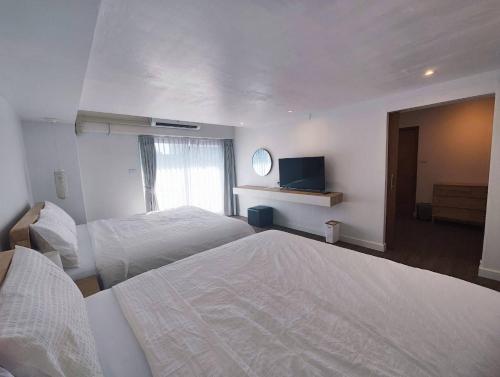 Katil atau katil-katil dalam bilik di Suneta Hostel Chiangmai