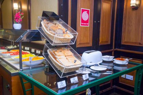 a buffet of food in a hotel room at Marco Polo Hotel in Dubai