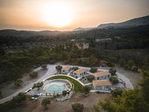 an aerial view of a house with a swimming pool at AGROTOPIA Guesthouses in Theologos