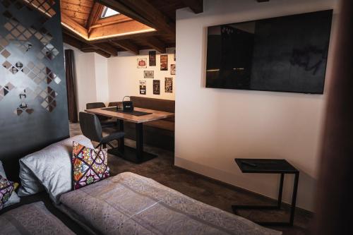 a living room with a couch and a table at PHILSON Apartments in Saalbach Hinterglemm
