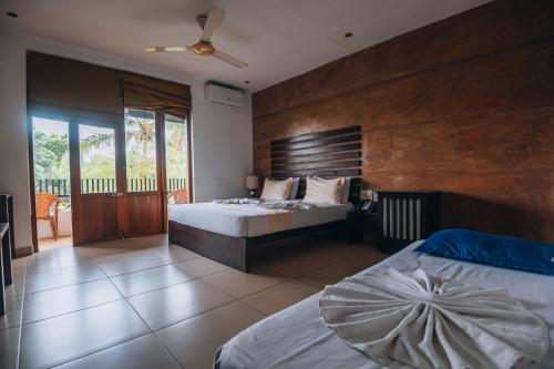 Postel nebo postele na pokoji v ubytování Summerside Residence